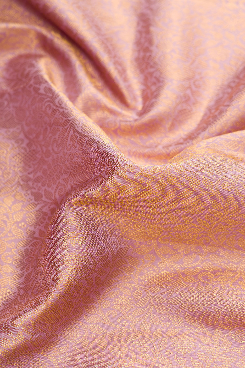 Close up of Lilac Dual Tone Kanjivaram Silk Saree with Zari Brocade on the body and Zari Border.  displaying folds