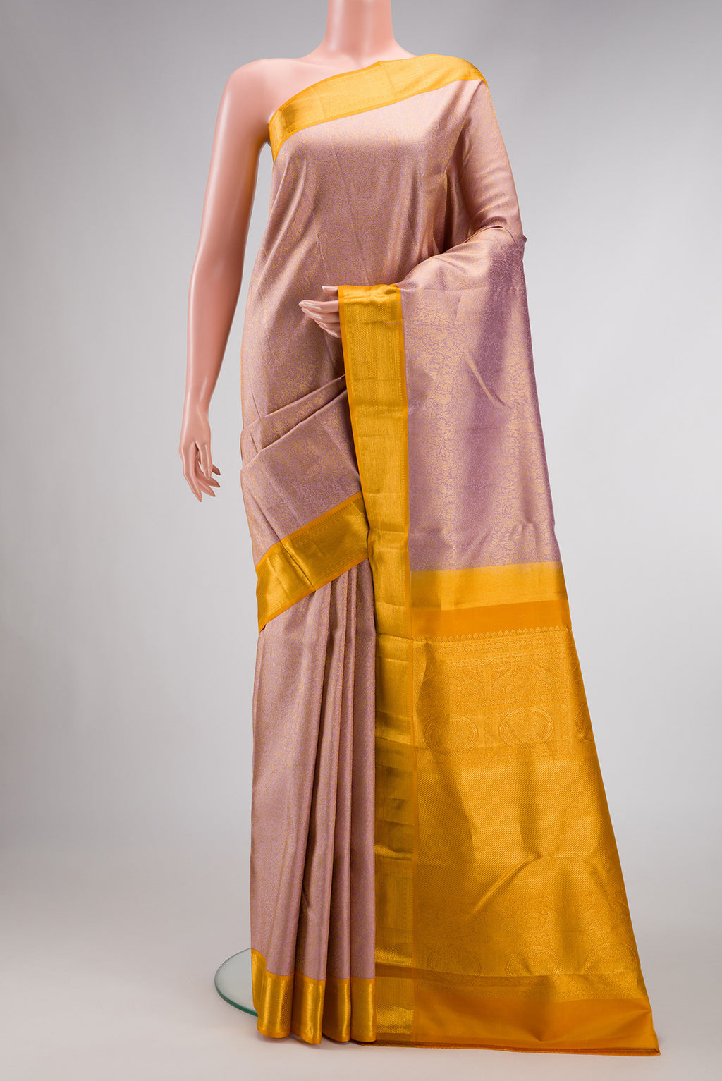 Lilac Dual Tone Kanjivaram Silk Saree with Zari Brocade on the body and Zari Border.  displayed on a mannequin
