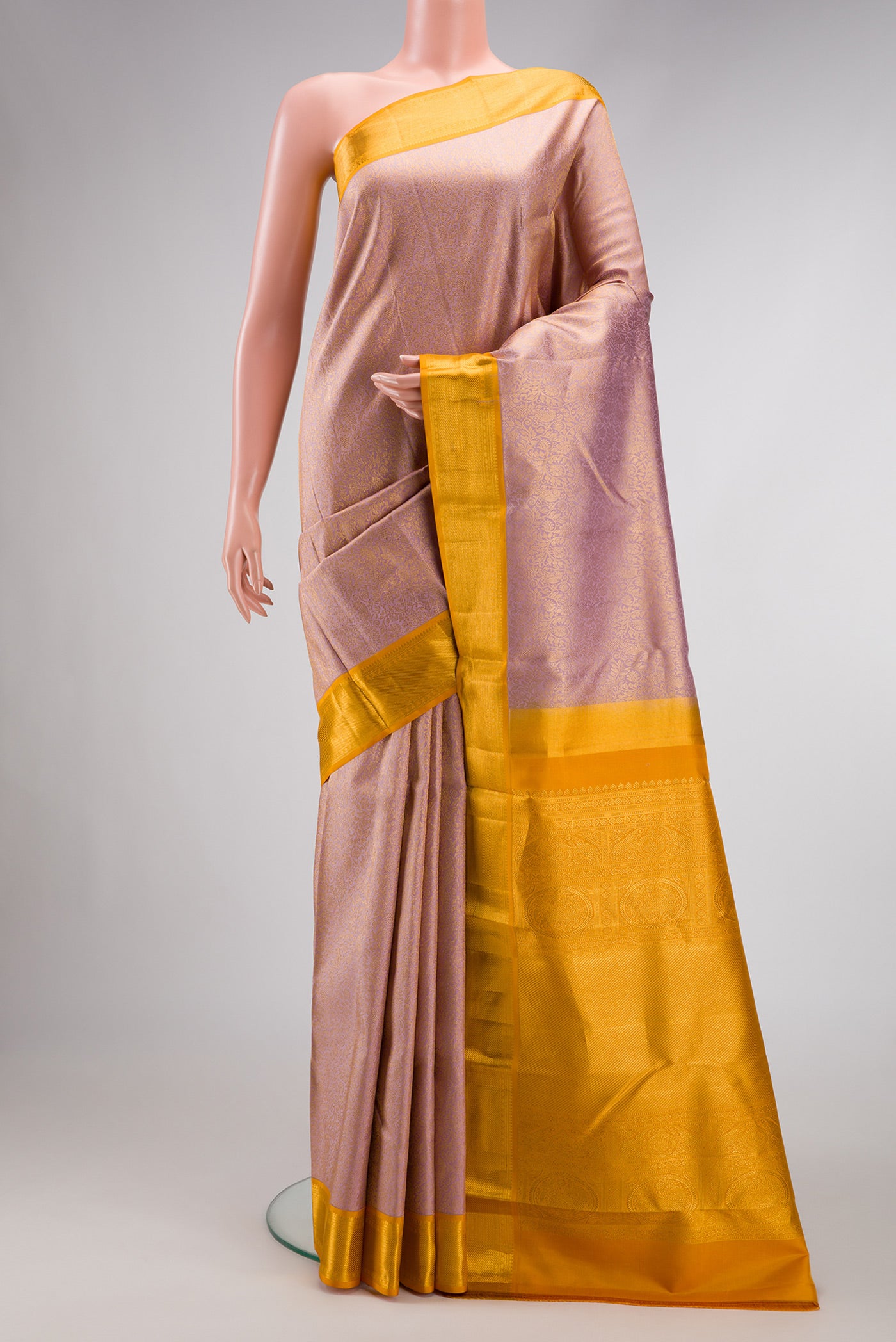 Lilac Dual Tone Kanjivaram Silk Saree with Zari Brocade on the body and Zari Border.  displayed on a mannequin