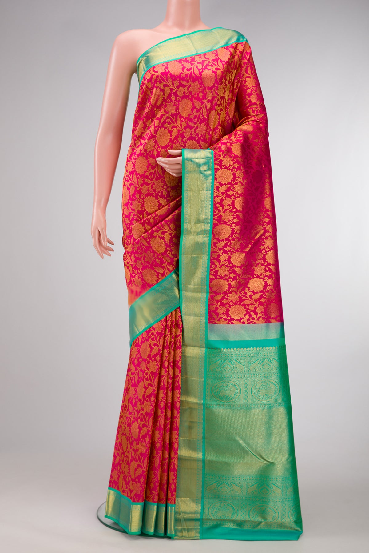 Dark Pink Dual Tone Kanjivaram Silk Saree with Zari Brocade on the body and Zari Border.  displayed on a mannequin