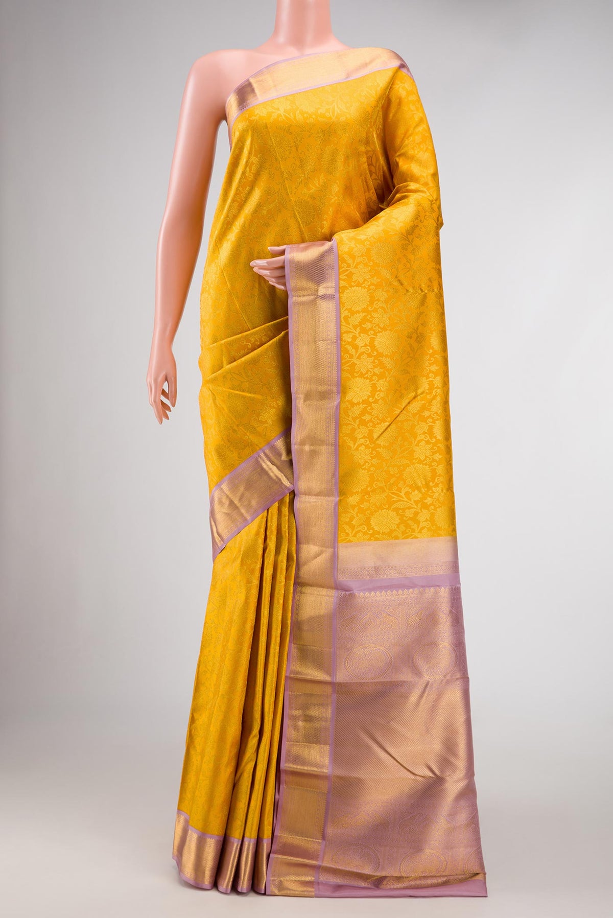 Mustard Dual Tone Kanjivaram Silk Saree with Zari Brocade on the body and Zari Border.  displayed on a mannequin