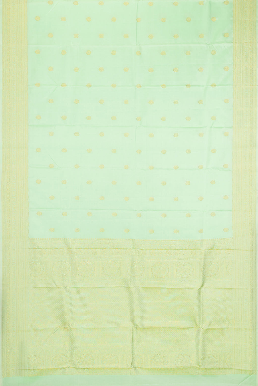Flat view of Pista Green Kanchipuram Silk Saree with Zari Butta on the body and Zari Border. 