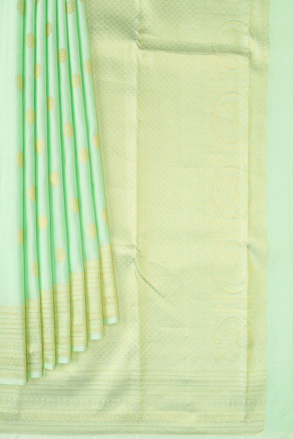 Pleats and pallu of Pista Green Kanchipuram Silk Saree with Zari Butta on the body and Zari Border. 
