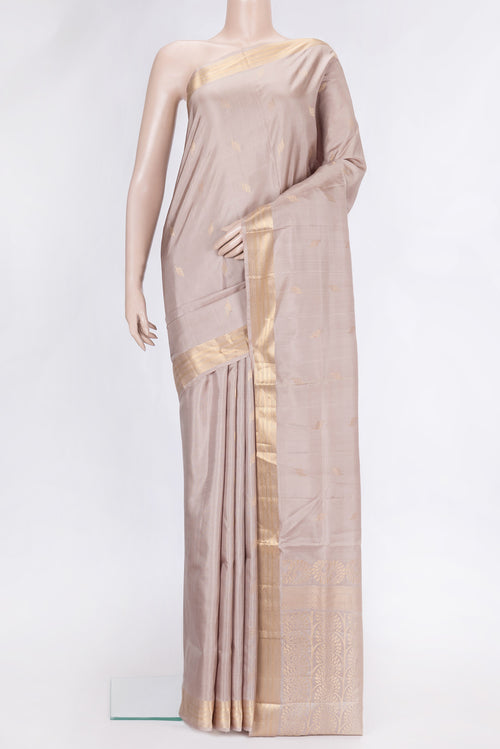 Beige Dual Tone Soft Silk Saree with Zari Butta on the body and Zari Border.  displayed on a mannequin