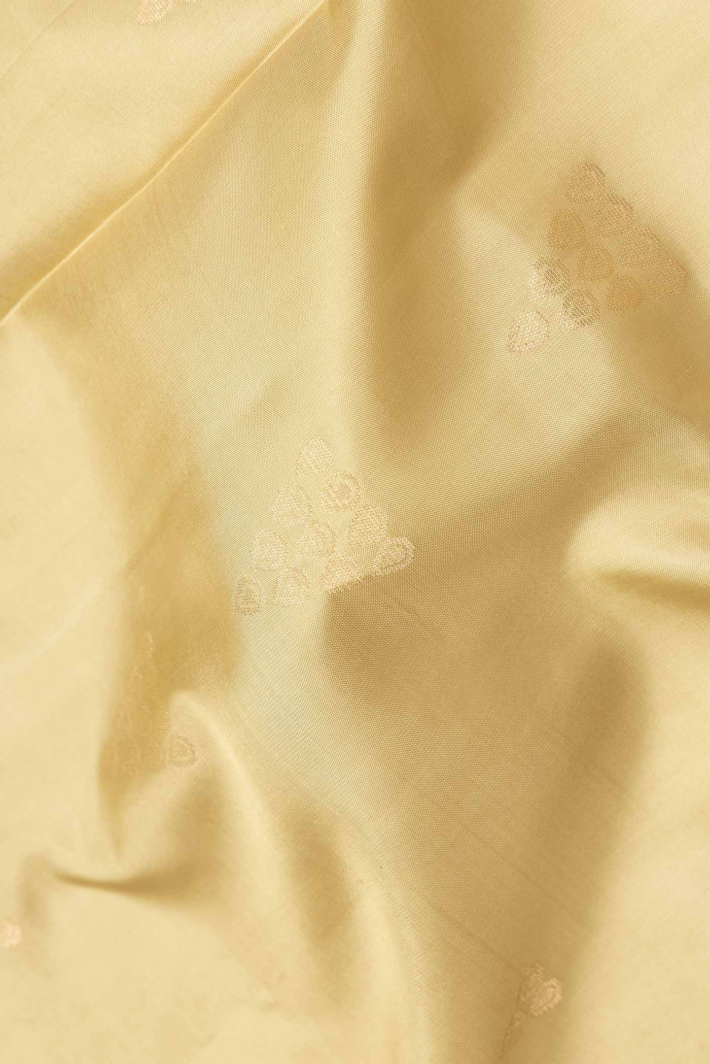 Close up of Pista Green Dual Tone Soft Silk Saree with Zari Butta on the body and Zari Border.  displaying folds