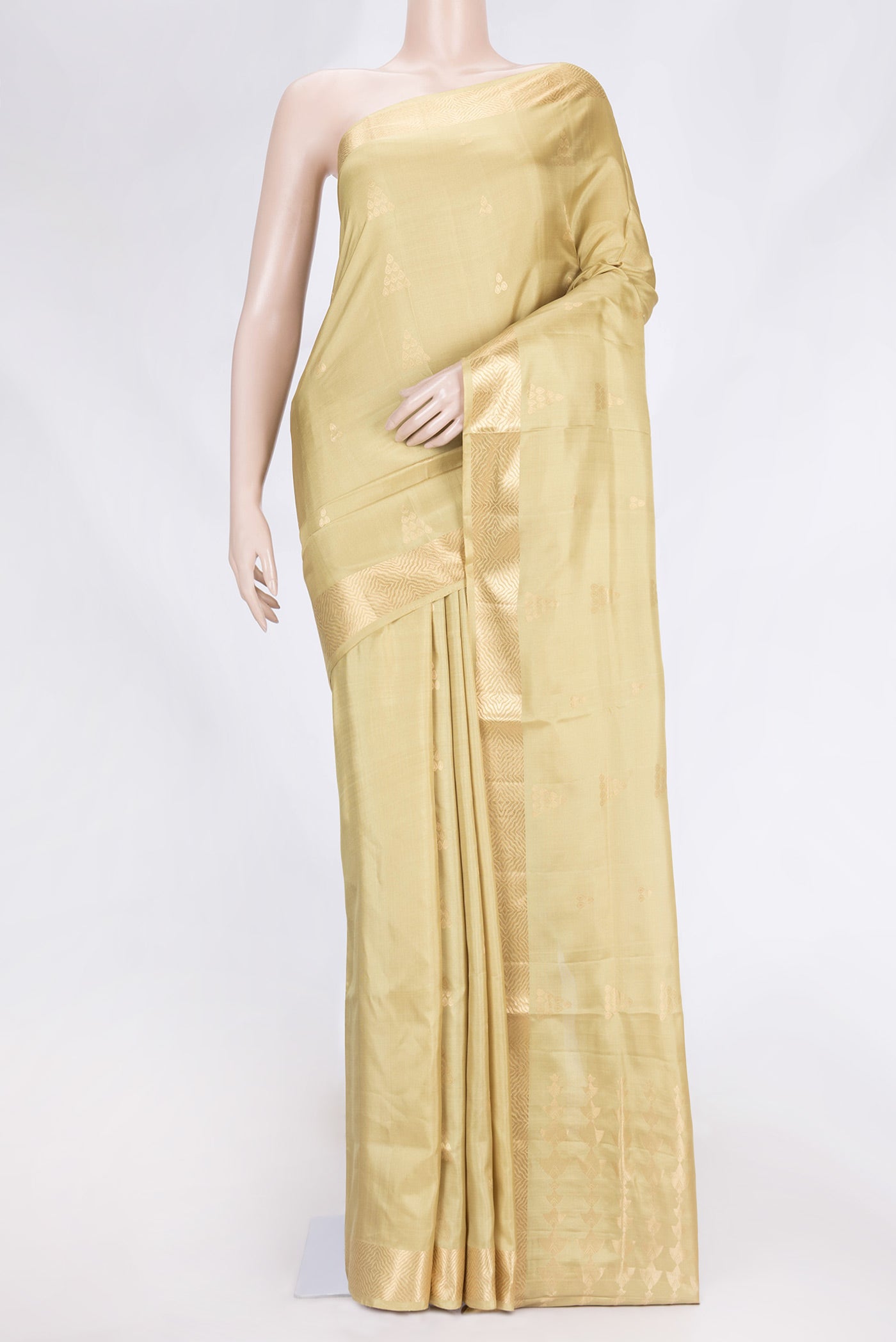 Pista Green Dual Tone Soft Silk Saree with Zari Butta on the body and Zari Border.  displayed on a mannequin