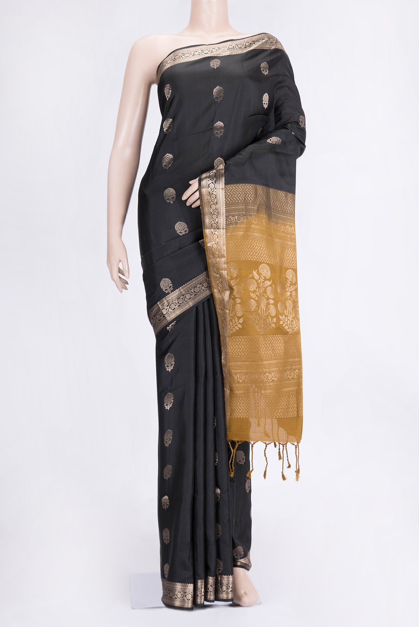 Black Dual Tone Soft Silk Saree with Zari Butta on the body and Zari Border.  displayed on a mannequin