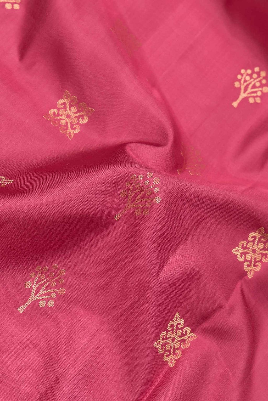 Close up of Dark Pink Dual Tone Soft Silk Saree with Zari Butta on the body and Zari Border.  displaying folds