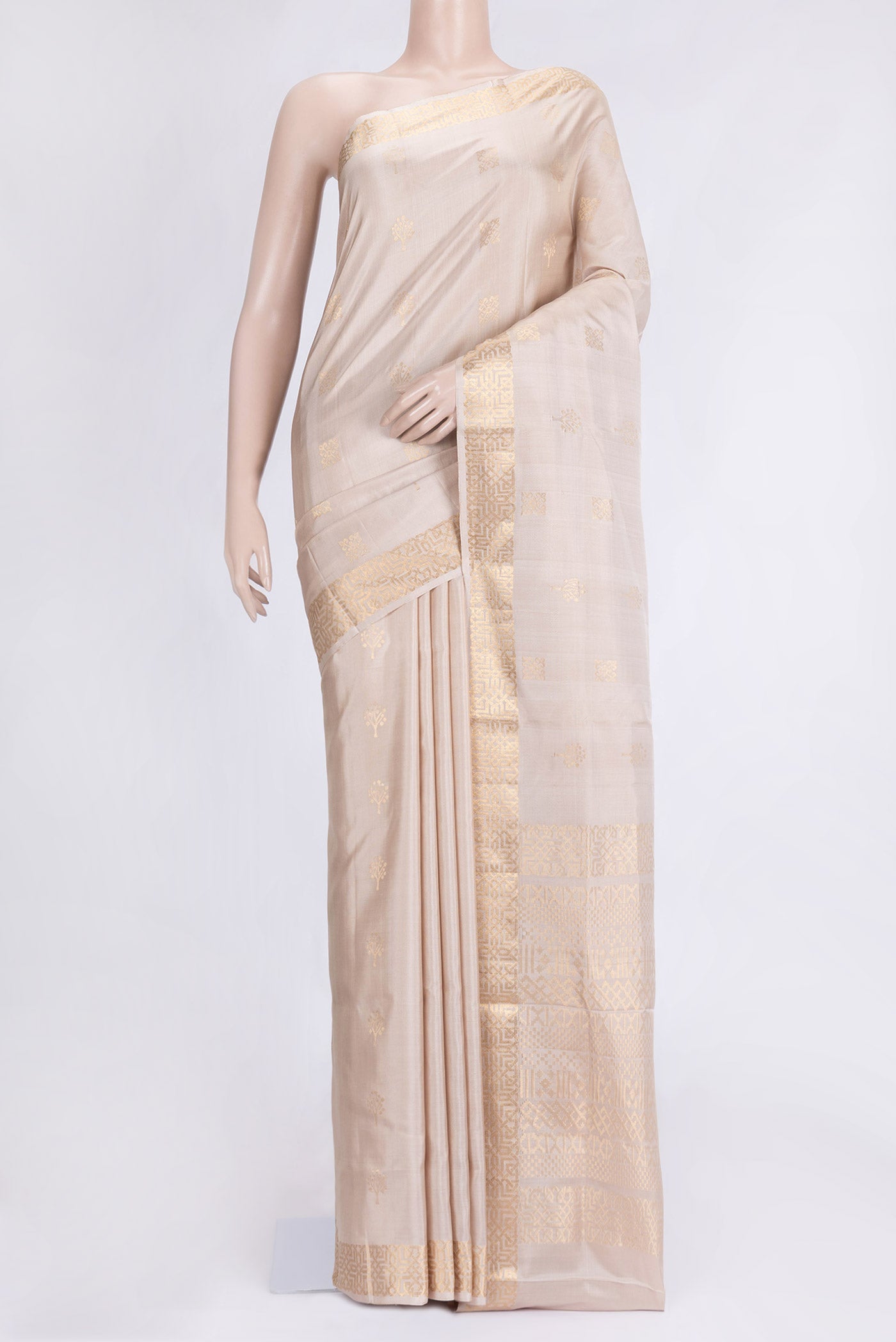 Beige Dual Tone Soft Silk Saree with Zari Butta on the body and Zari Border.  displayed on a mannequin