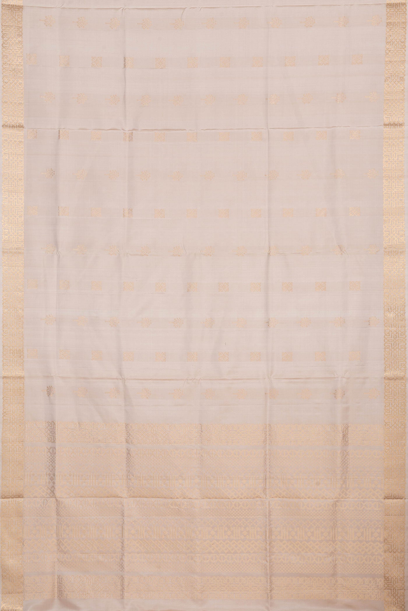 Flat view of Beige Dual Tone Soft Silk Saree with Zari Butta on the body and Zari Border. 