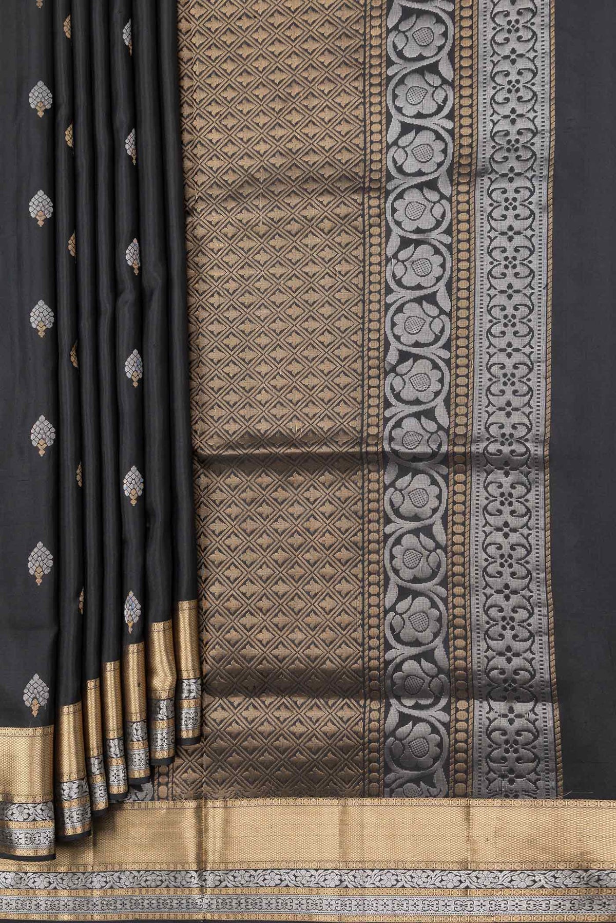 Pleats and pallu of Black Dual Tone Soft Silk Saree with Zari Butta on the body and Zari Border. 