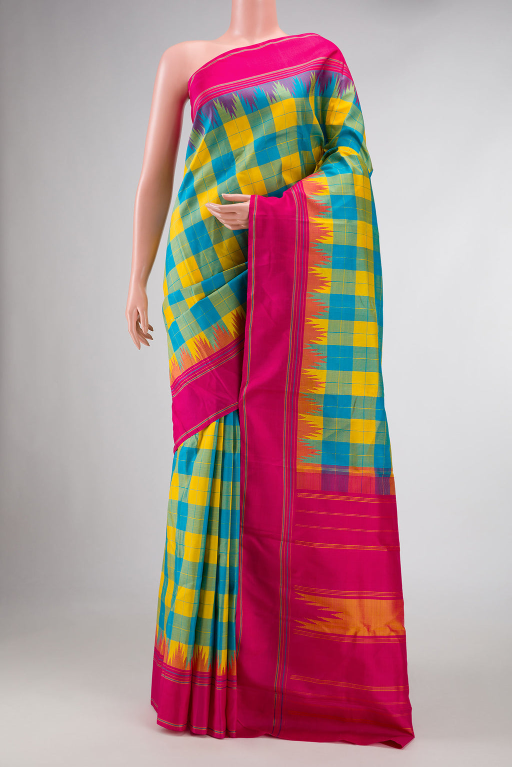 Green and Yellow Color Kanchipuram Silk Saree with Checked design on the body and Thread Border displayed on a mannequin