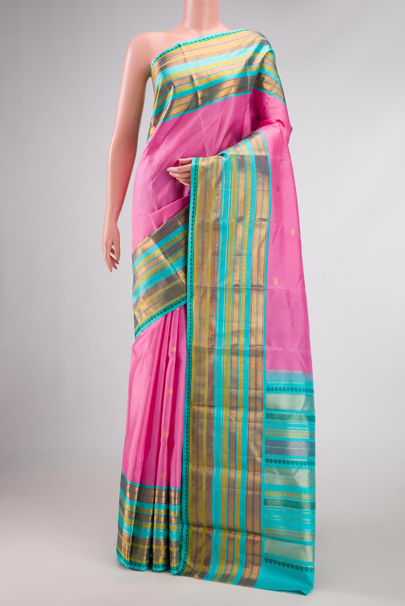 Pink Dual Tone Kanjivaram Silk Saree with Zari Butta on the body and Zari Border.  displayed on a mannequin