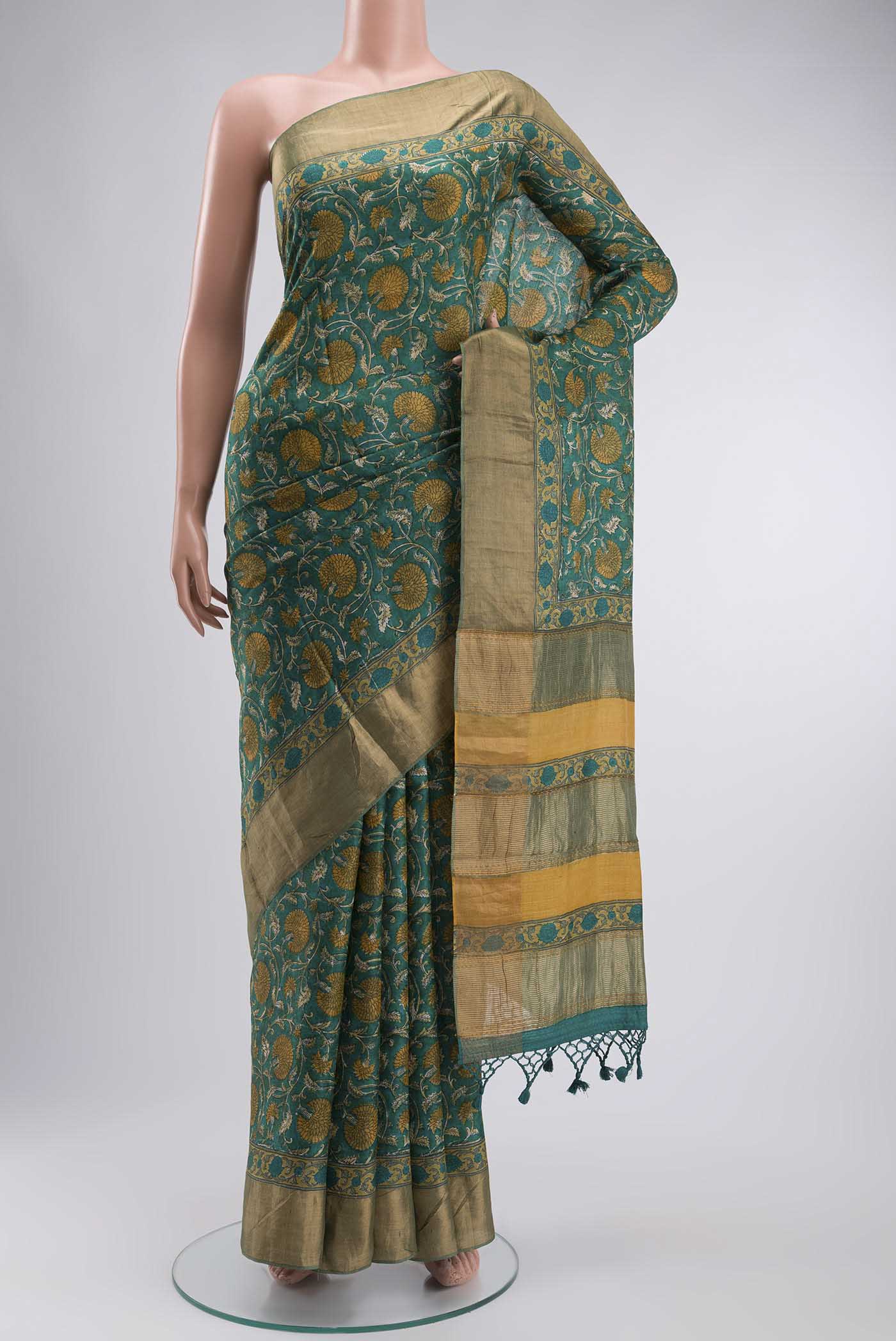 Green Bhagalpuri Tussar Silk Saree with Printed design on the body and Zari Border displayed on a mannequin