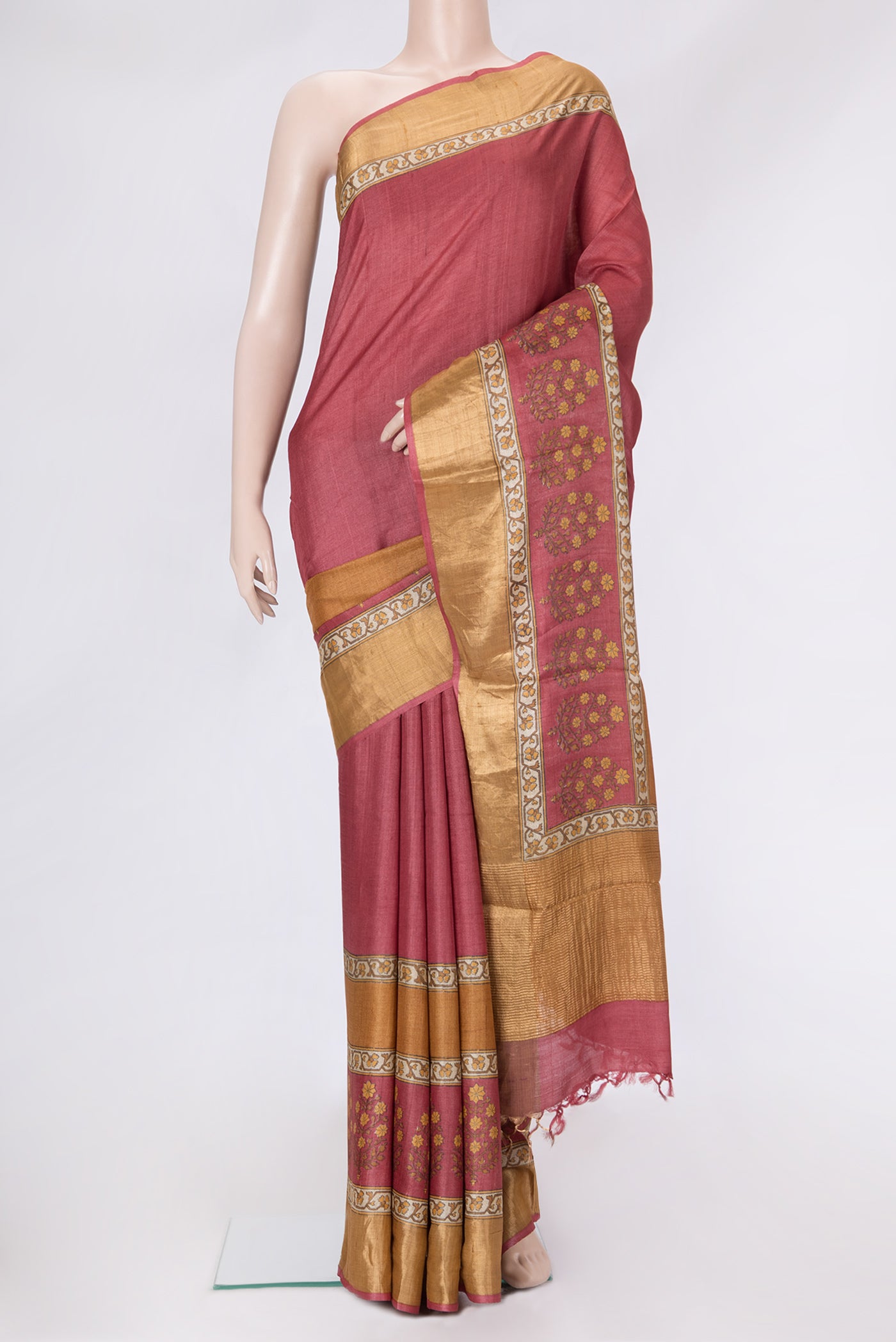 Maroon Dual Tone Tussar Silk Saree with Printed design on the body and Zari Border.  displayed on a mannequin