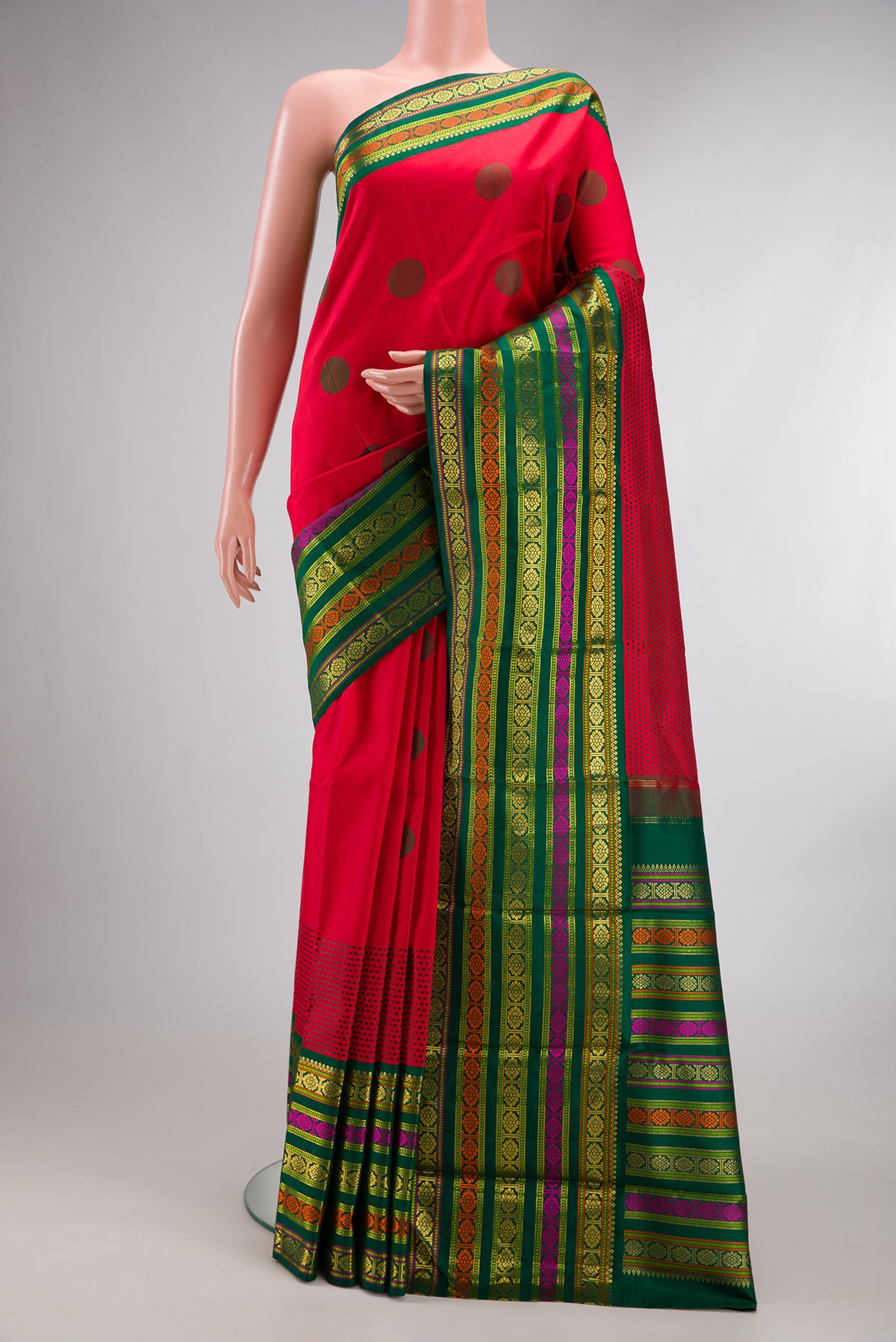Pure Silk Red Kanchipuram Saree with Thread Butta on the body and Zari And Thread Border.  displayed on a mannequin