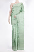Pure Silk Pista Green Kanjivaram Saree with Zari Brocade on the body and Fancy Border.  displayed on a mannequin