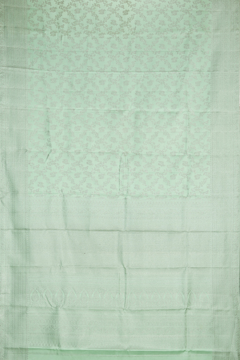Flat view of Pure Silk Pista Green Kanjivaram Saree with Zari Brocade on the body and Fancy Border. 