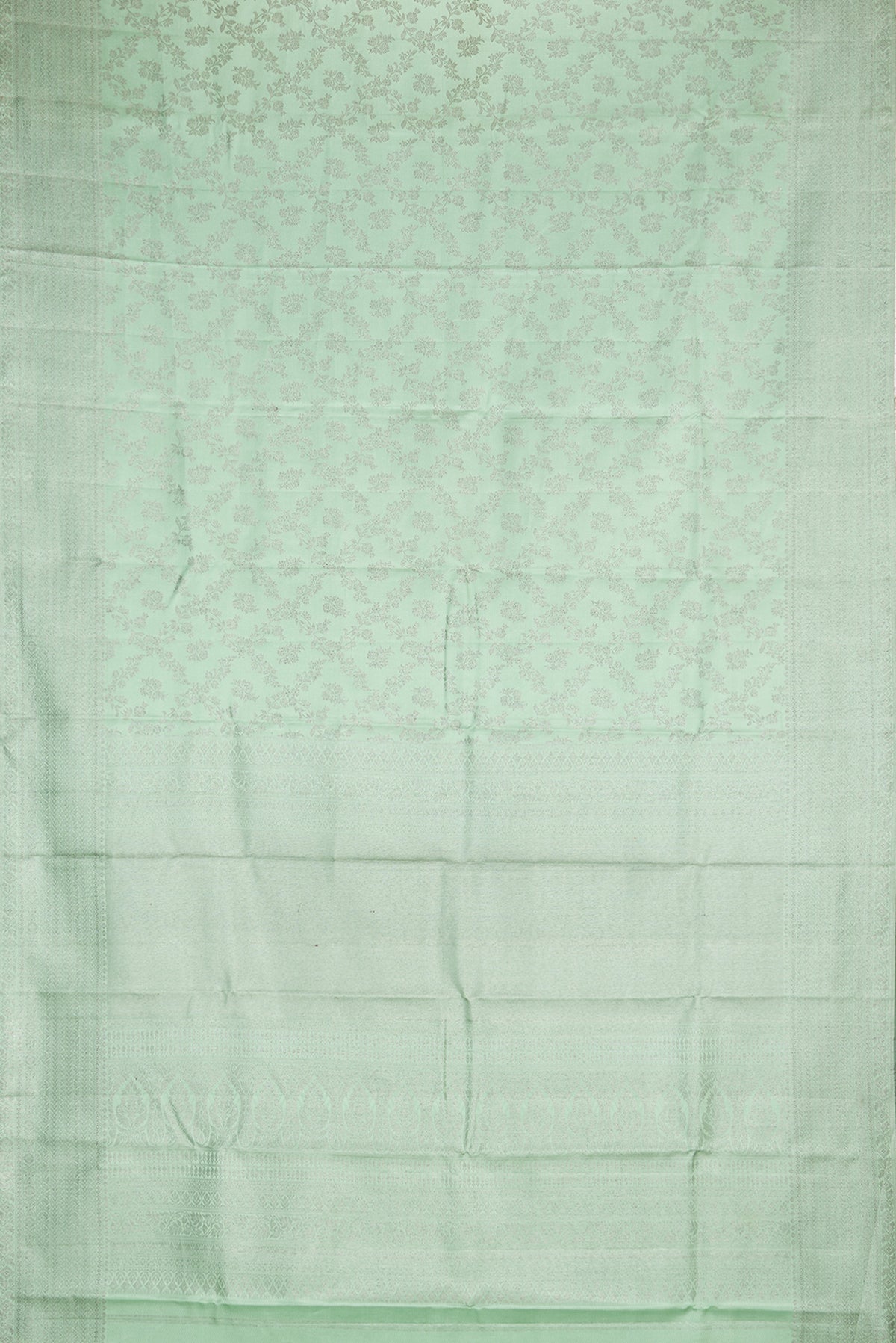 Flat view of Pure Silk Pista Green Kanjivaram Saree with Zari Brocade on the body and Fancy Border. 