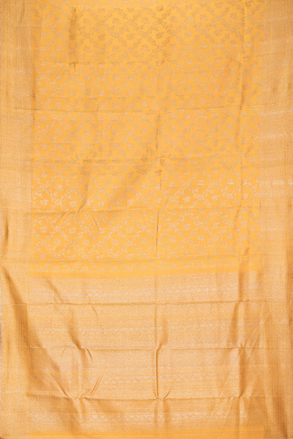 Flat view of Pure Silk Mustard Kanjivaram Saree with Zari Brocade on the body and Fancy Border. 