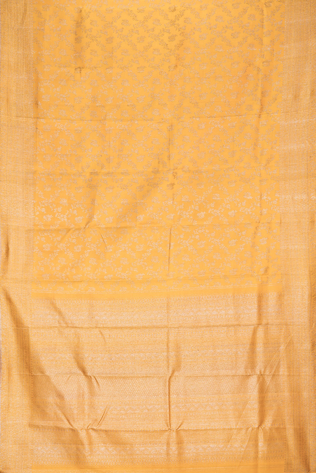 Flat view of Pure Silk Mustard Kanjivaram Saree with Zari Brocade on the body and Fancy Border. 