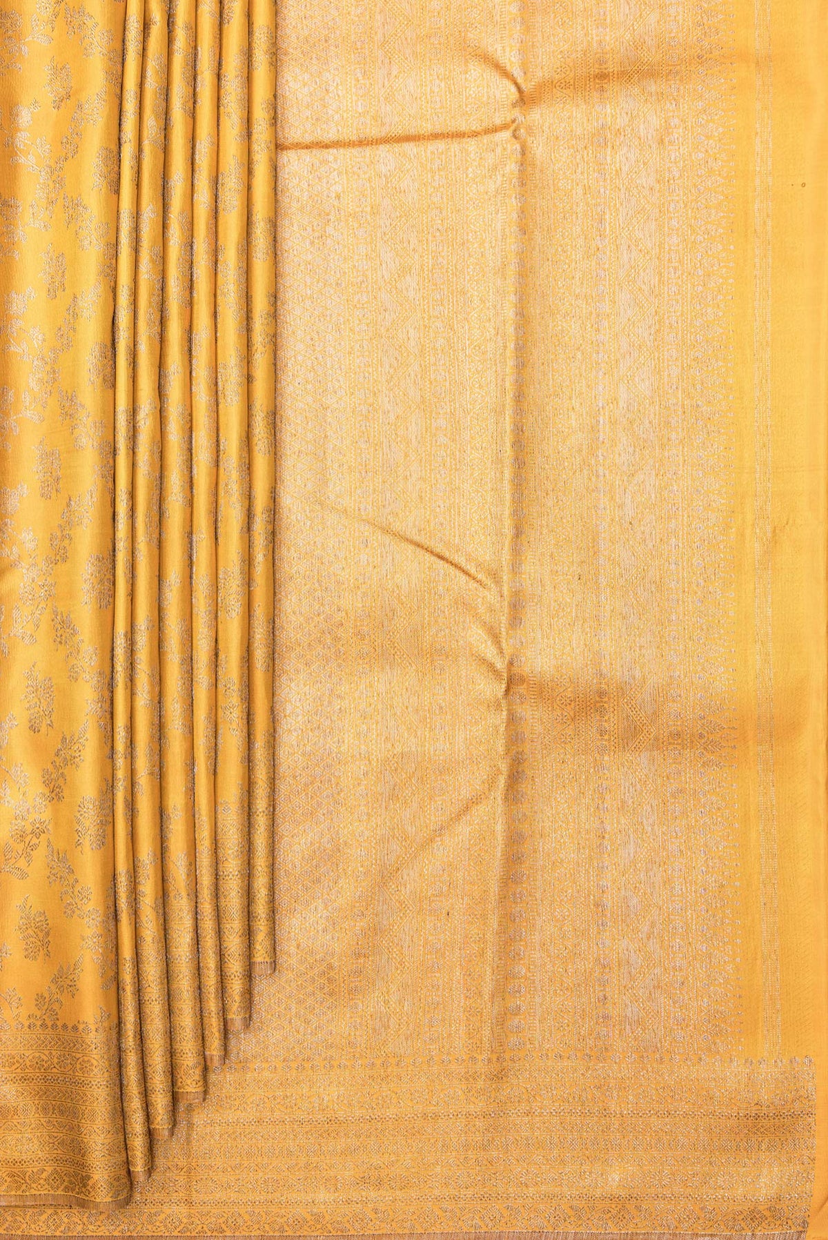 Pleats and pallu of Pure Silk Mustard Kanjivaram Saree with Zari Brocade on the body and Fancy Border. 