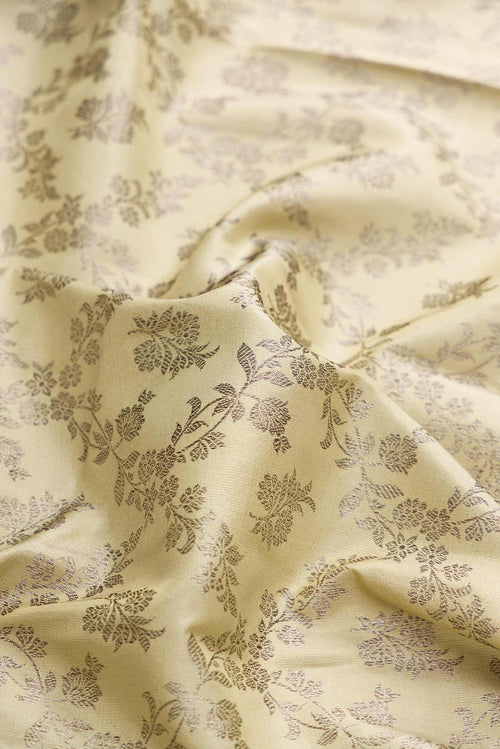Close up of Beige Dual Tone Kanchipuram Silk Saree with Zari Brocade on the body and Zari Border displaying folds