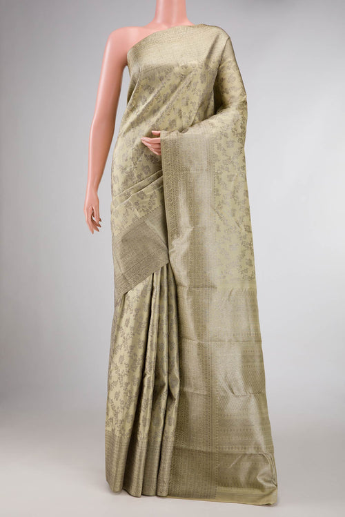 Beige Dual Tone Kanchipuram Silk Saree with Zari Brocade on the body and Zari Border displayed on a mannequin