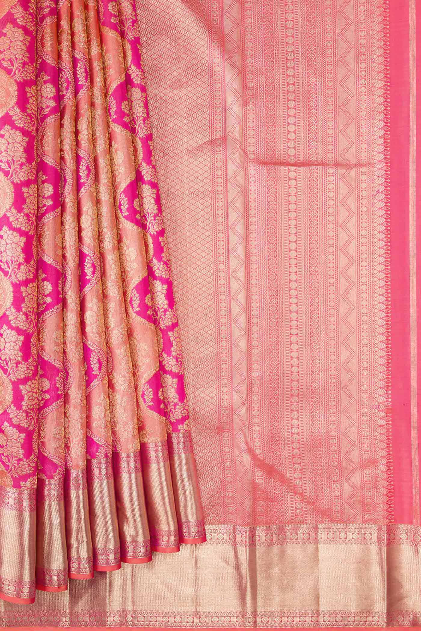 Pleats and pallu of Golden Peach and Pink Color Kanjivaram Silk Saree with Zari Brocade on the body and Zari Border. 
