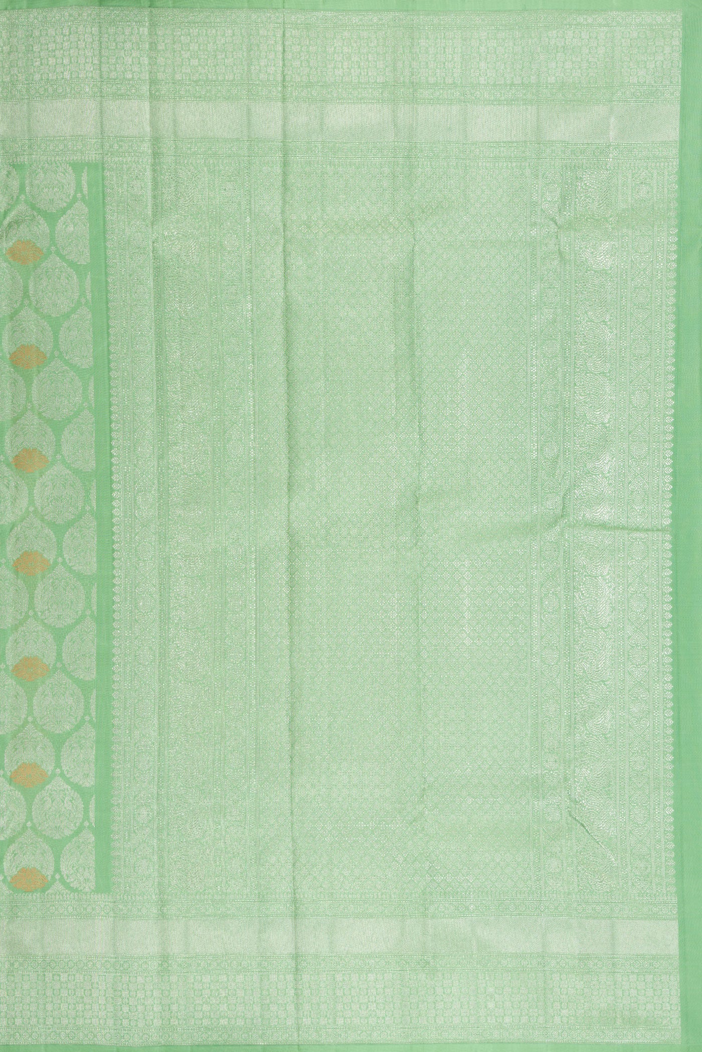 Close up image of the pallu of Light Green Dual Tone Kanchipuram Silk Saree with Zari Brocade on the body and Zari Border. 