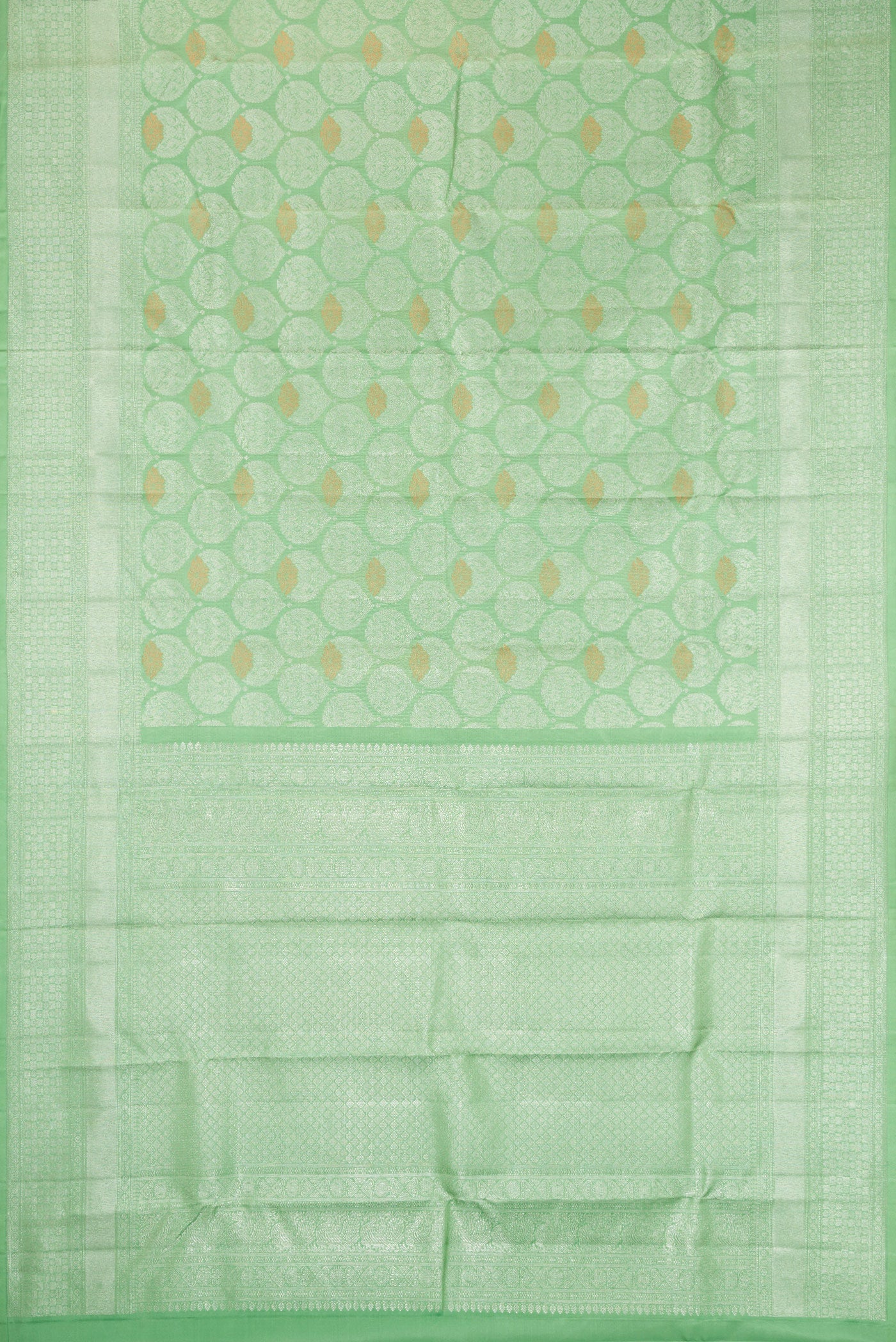 Flat view of Light Green Dual Tone Kanchipuram Silk Saree with Zari Brocade on the body and Zari Border. 