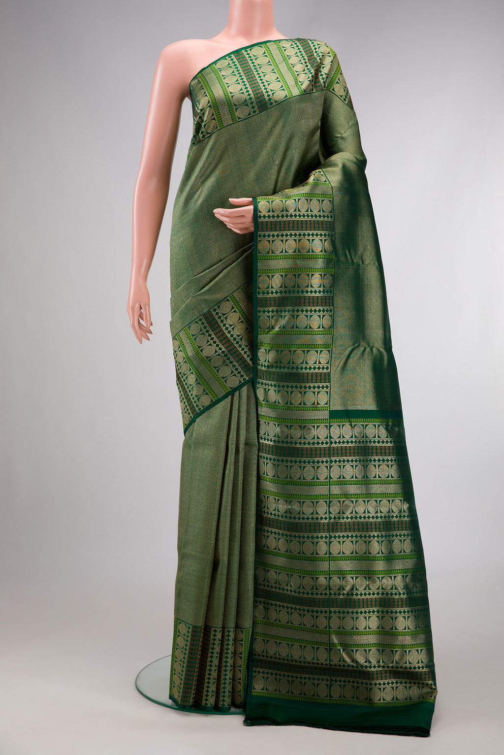 Green Dual Tone Kanchipuram Silk Saree with Zari Brocade on the body and Fancy Border.  displayed on a mannequin