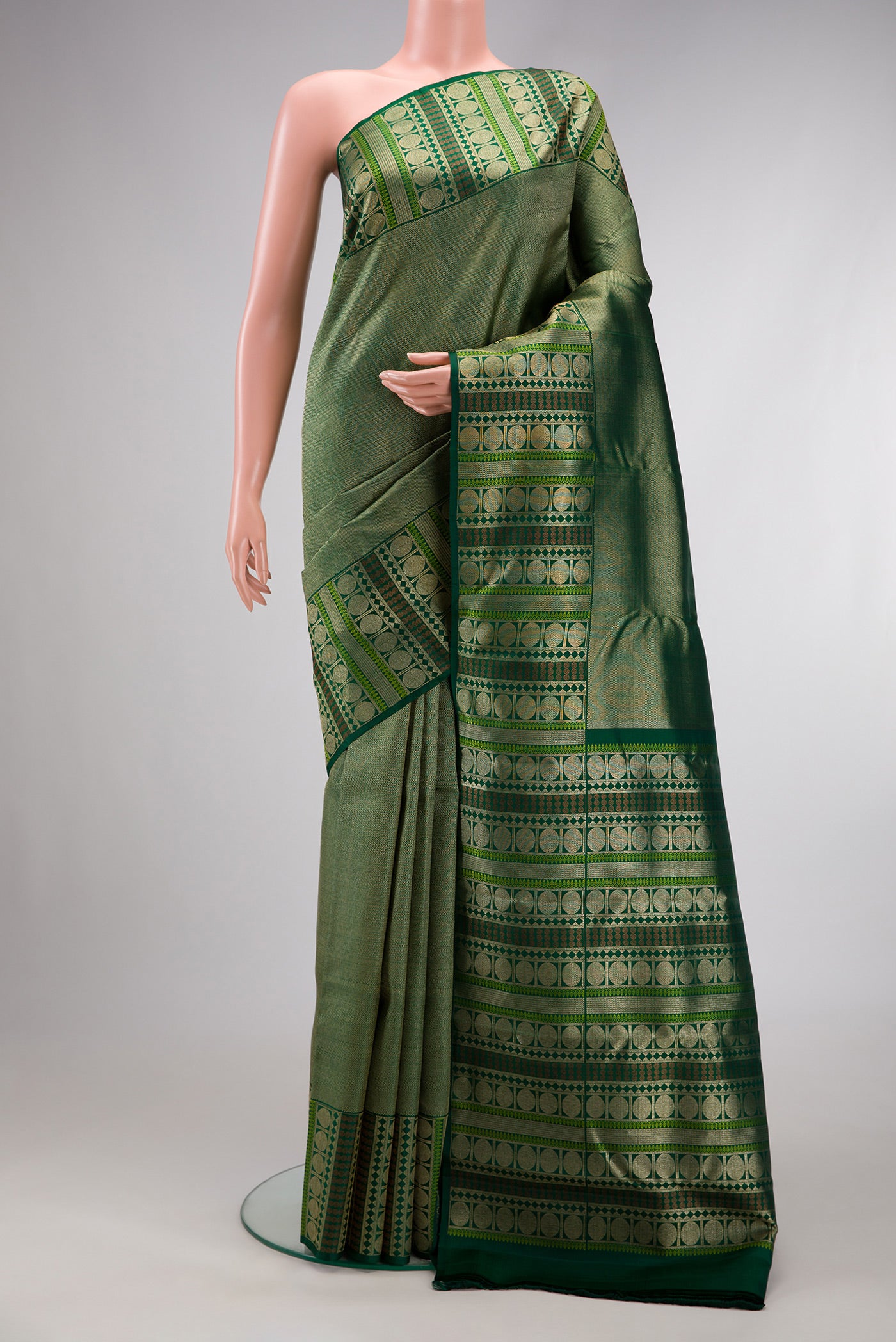 Green Dual Tone Kanchipuram Silk Saree with Zari Brocade on the body and Fancy Border.  displayed on a mannequin