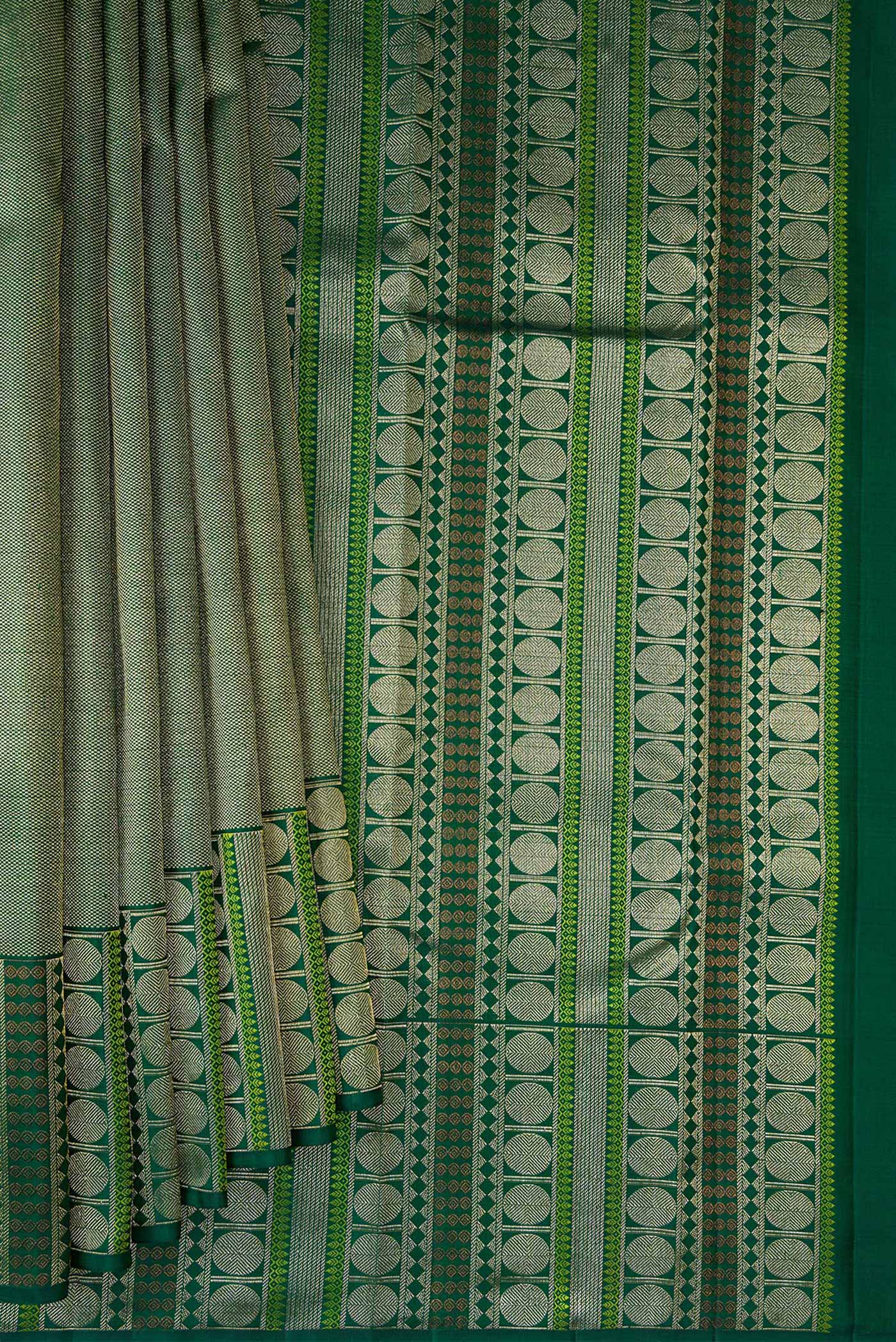 Pleats and pallu of Green Dual Tone Kanchipuram Silk Saree with Zari Brocade on the body and Fancy Border. 