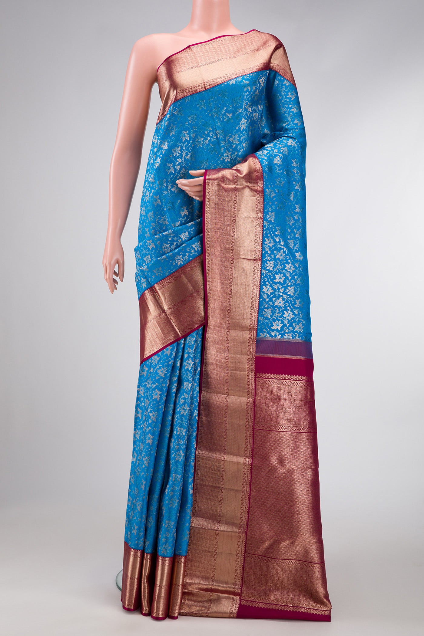 Sky Blue Dual Tone Kanchipuram Silk Saree with Zari Brocade on the body and Zari Border.  displayed on a mannequin