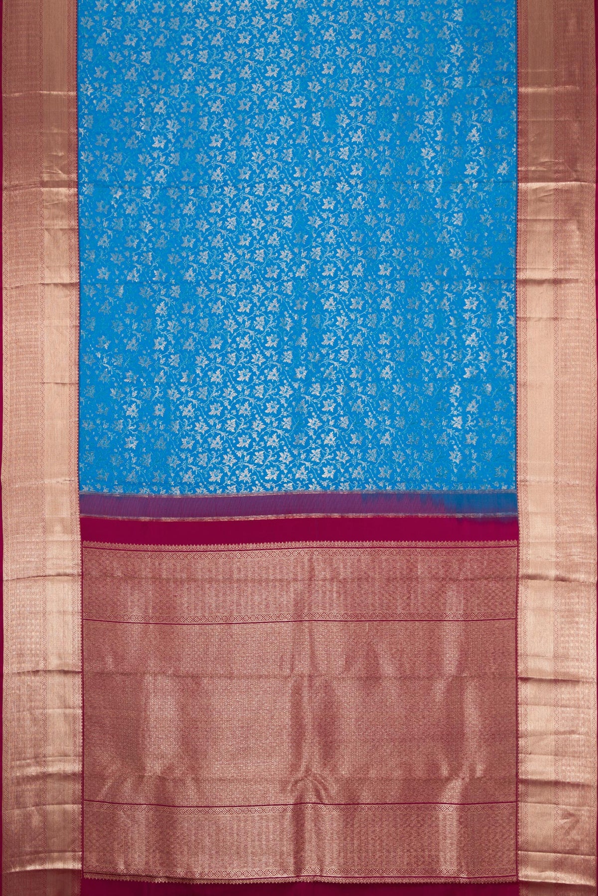 Flat view of Sky Blue Dual Tone Kanchipuram Silk Saree with Zari Brocade on the body and Zari Border. 