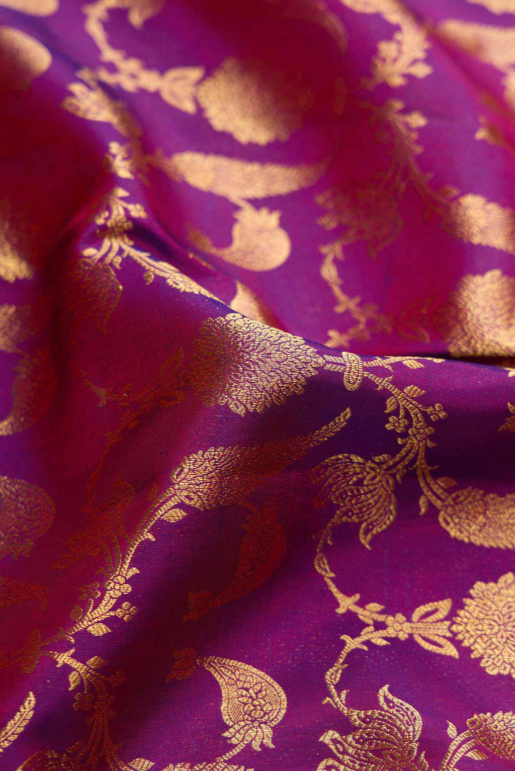 Close up of Purple Dual Tone Kanchipuram Silk Saree with Zari Brocade on the body and Zari Border.  displaying folds