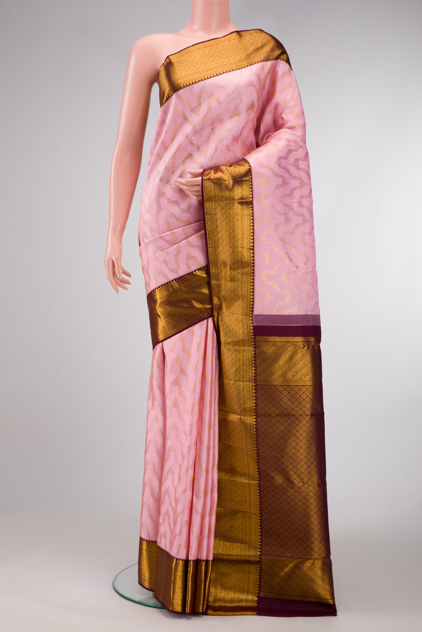Pink Dual Tone Kanchipuram Silk Saree with Zari Brocade on the body and Zari Border.  displayed on a mannequin