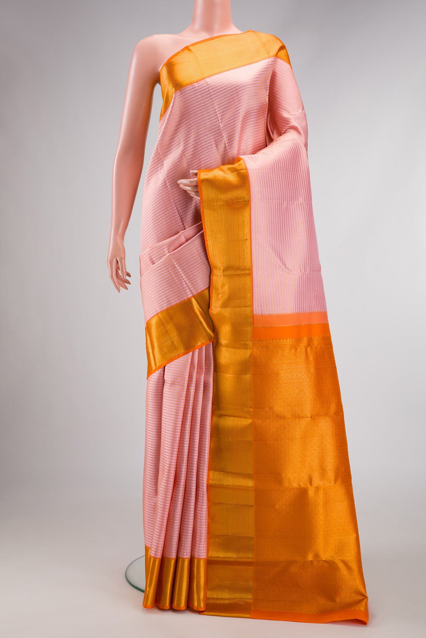 Pink Dual Tone Kanchipuram Silk Saree with Zari Brocade on the body and Zari Border.  displayed on a mannequin