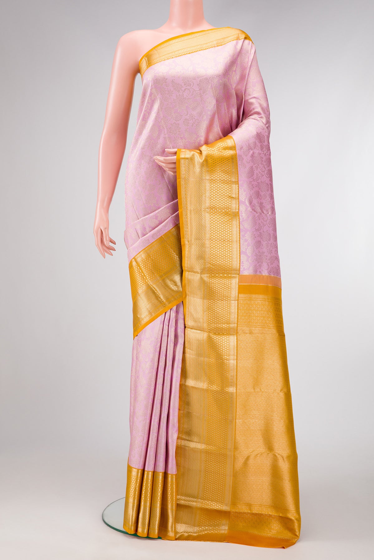 Lavender Dual Tone Kanjivaram Silk Saree with Zari Brocade on the body and Zari Border.  displayed on a mannequin