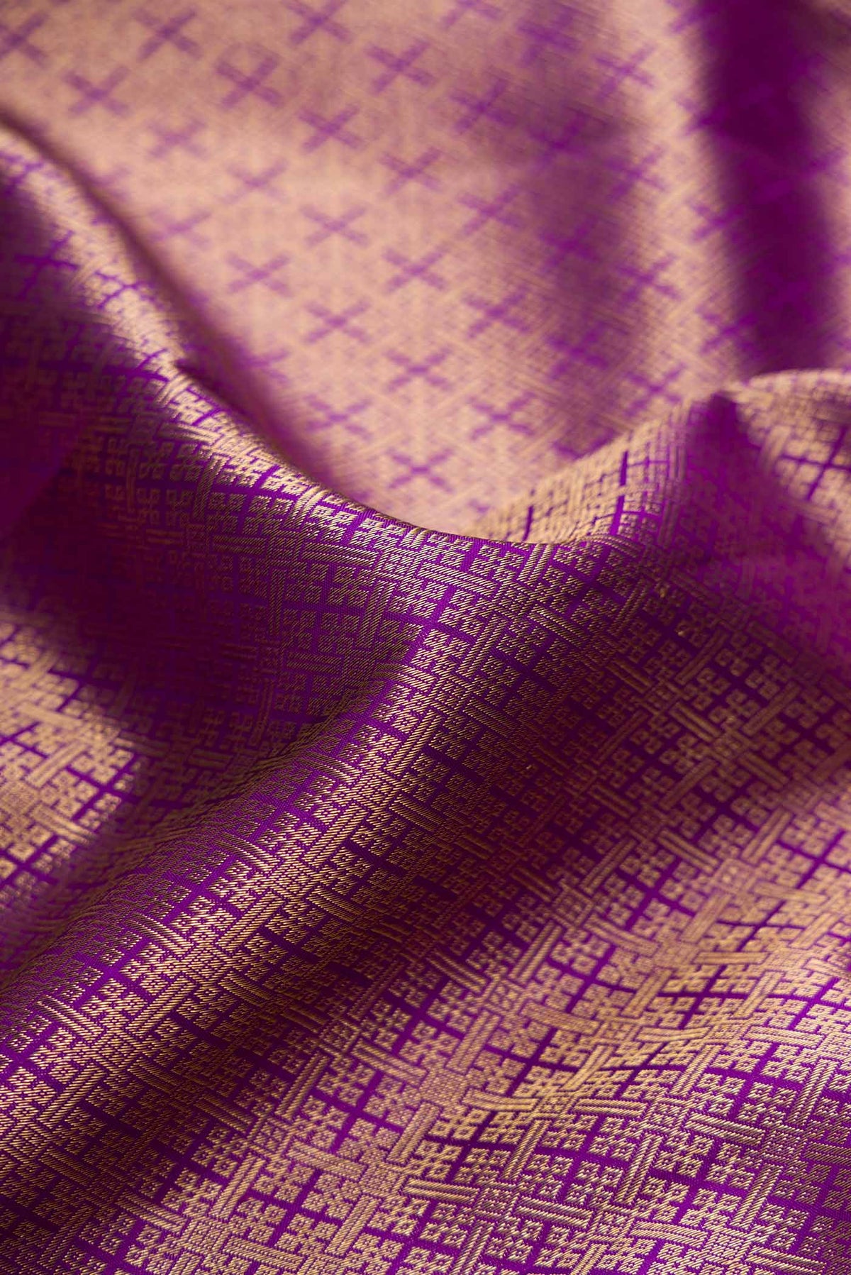 Close up of Purple Dual Tone Kanjivaram Silk Saree with Zari Brocade on the body and Zari Border.  displaying folds
