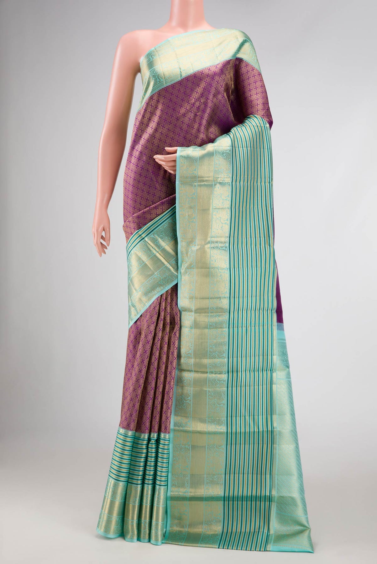 Purple Dual Tone Kanjivaram Silk Saree with Zari Brocade on the body and Zari Border.  displayed on a mannequin