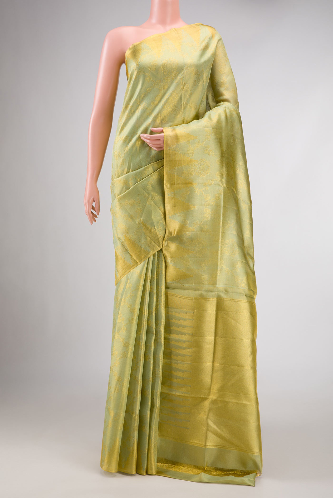 Light Green Dual Tone Kanchipuram Tissue Silk Saree with Zari Brocade on the body and Zari Border.  displayed on a mannequin
