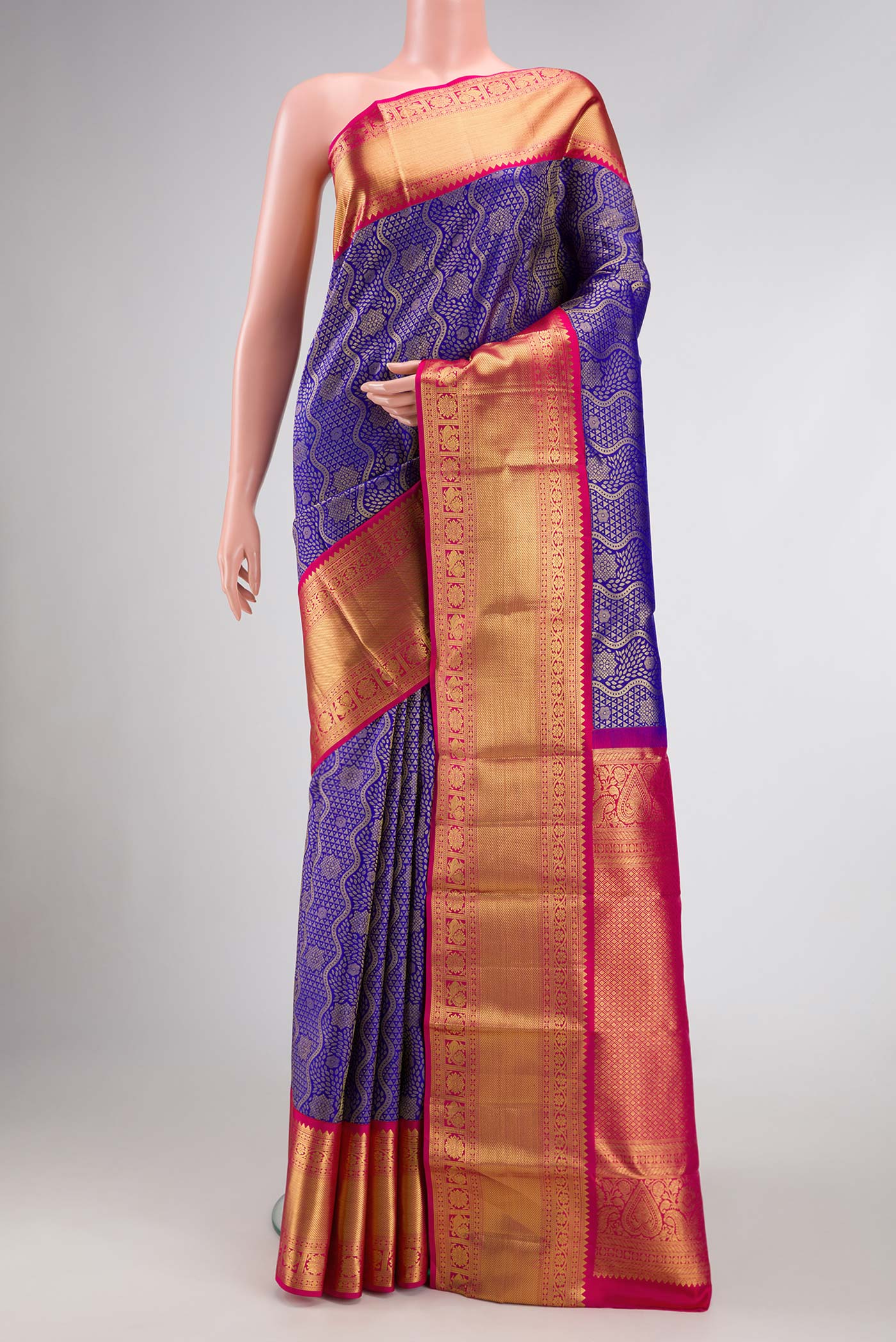 Royal Blue Dual Tone Kanjivaram Silk Saree with Zari Brocade on the body and Zari Border.  displayed on a mannequin