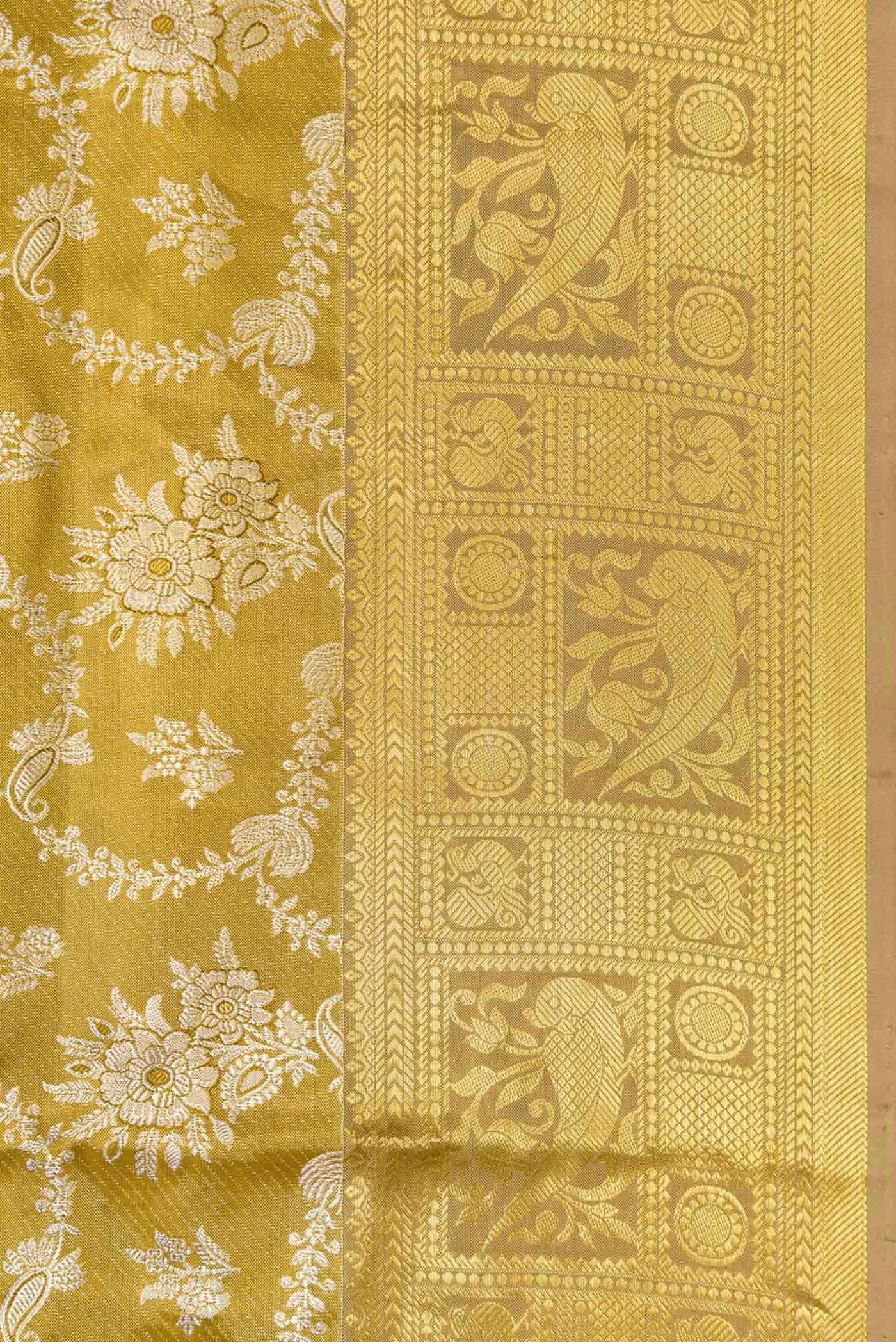 Border image of Gold Dual Tone Kanjivaram Tissue Silk Saree with Zari Brocade on the body and Zari Border. 