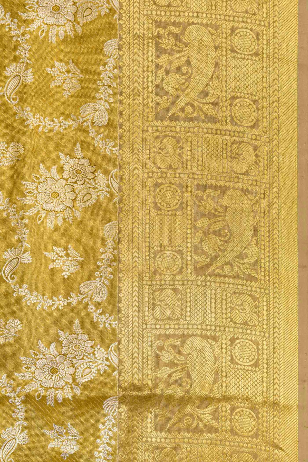 Border image of Gold Dual Tone Kanjivaram Tissue Silk Saree with Zari Brocade on the body and Zari Border. 