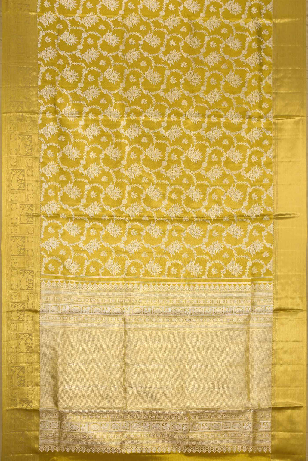 Flat view of Gold Dual Tone Kanjivaram Tissue Silk Saree with Zari Brocade on the body and Zari Border. 