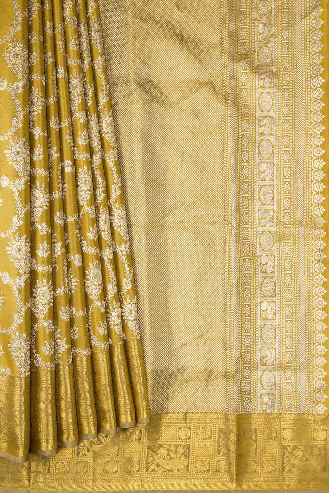 Pleats and pallu of Gold Dual Tone Kanjivaram Tissue Silk Saree with Zari Brocade on the body and Zari Border. 