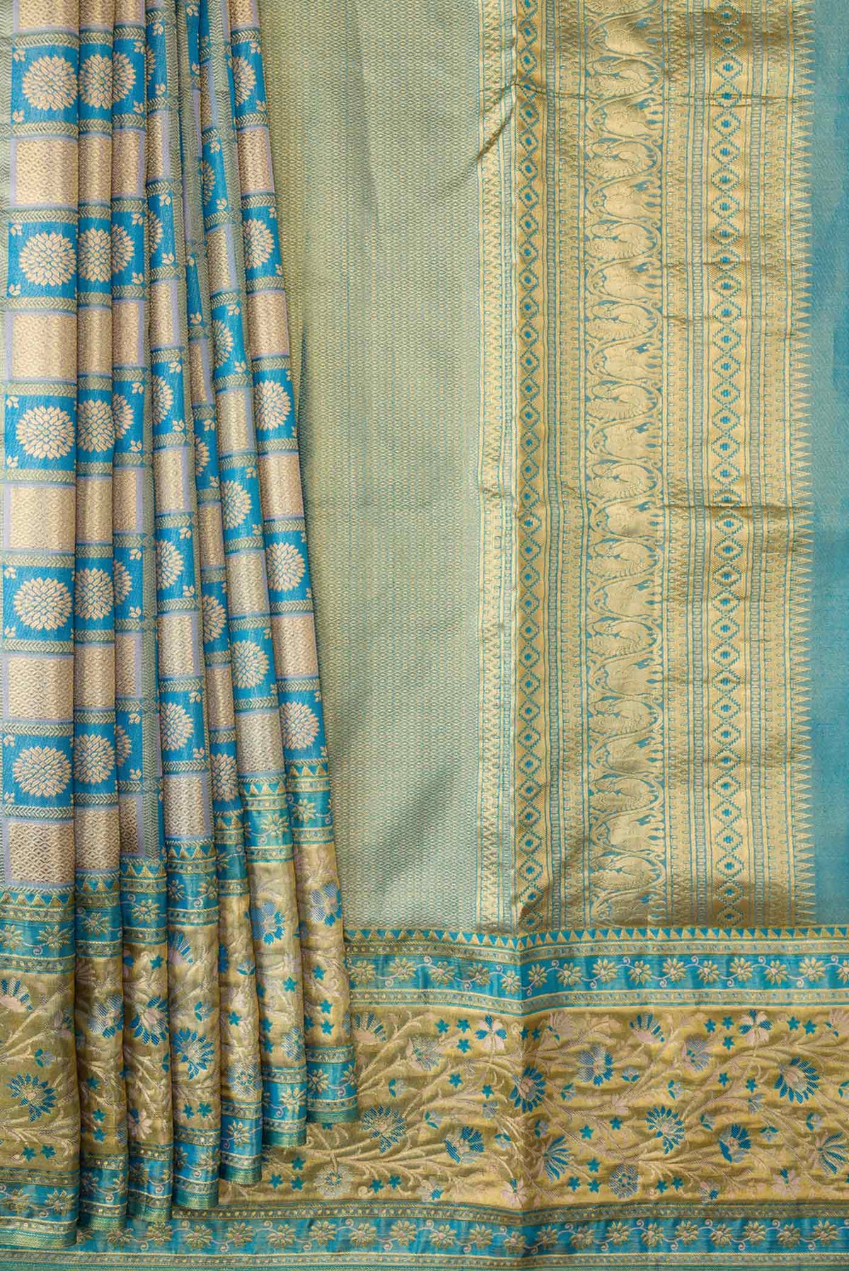 Pleats and pallu of Peacock Blue Dual Tone Kanchipuram Tissue Silk Saree with Zari Brocade on the body and Fancy Border