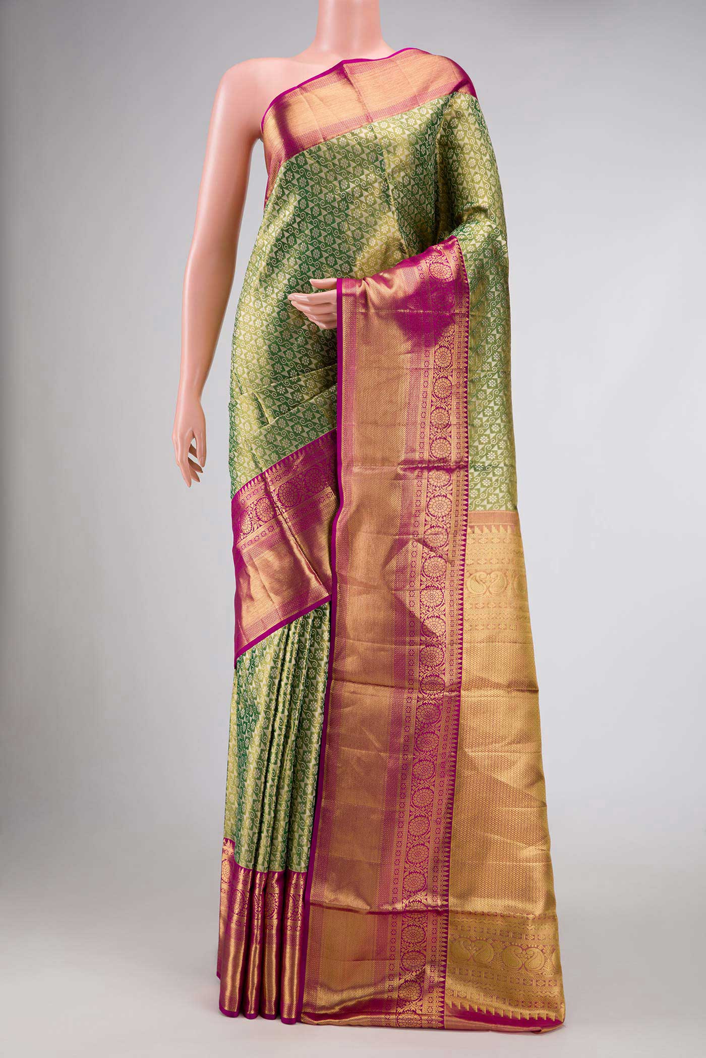 Green Dual Tone Kanchipuram Tissue Silk Saree with Zari Brocade on the body and Zari Border.  displayed on a mannequin